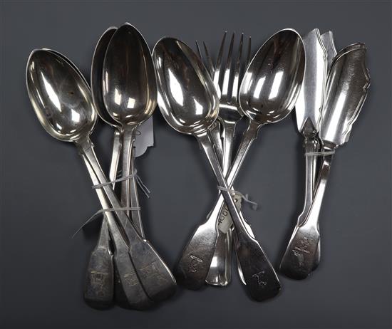 Five George III silver table spoons, two pairs of Victorian butter knives, two table spoons and two table forks